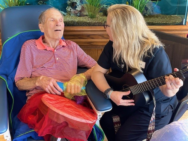 Cara Perkins, music therapist, leads individual and group music therapy sessions.